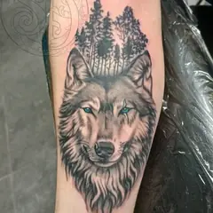 Black and grey wolf tattoo by Elora Hinton
